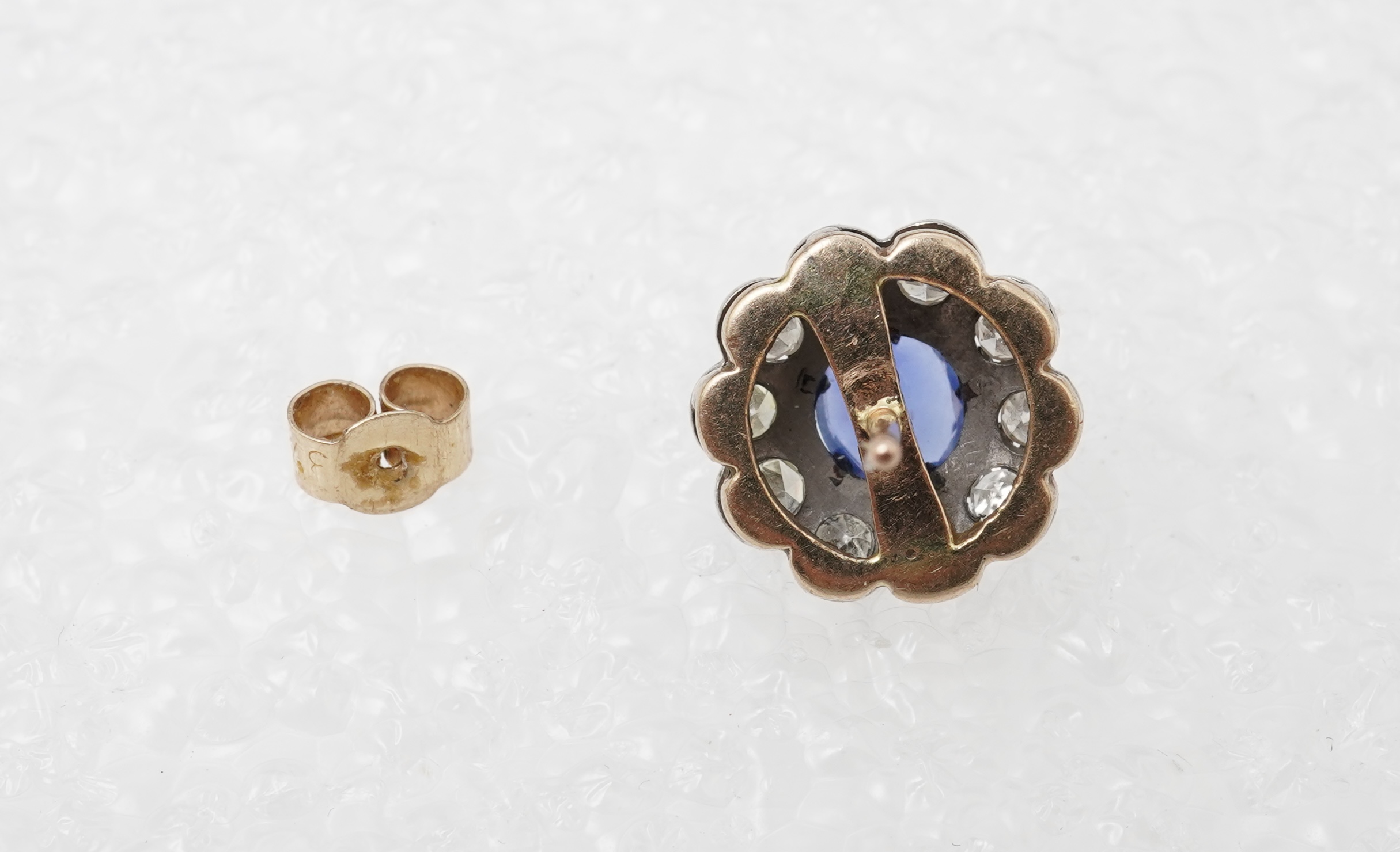A pair of sapphire and diamond studs, mid 20th century